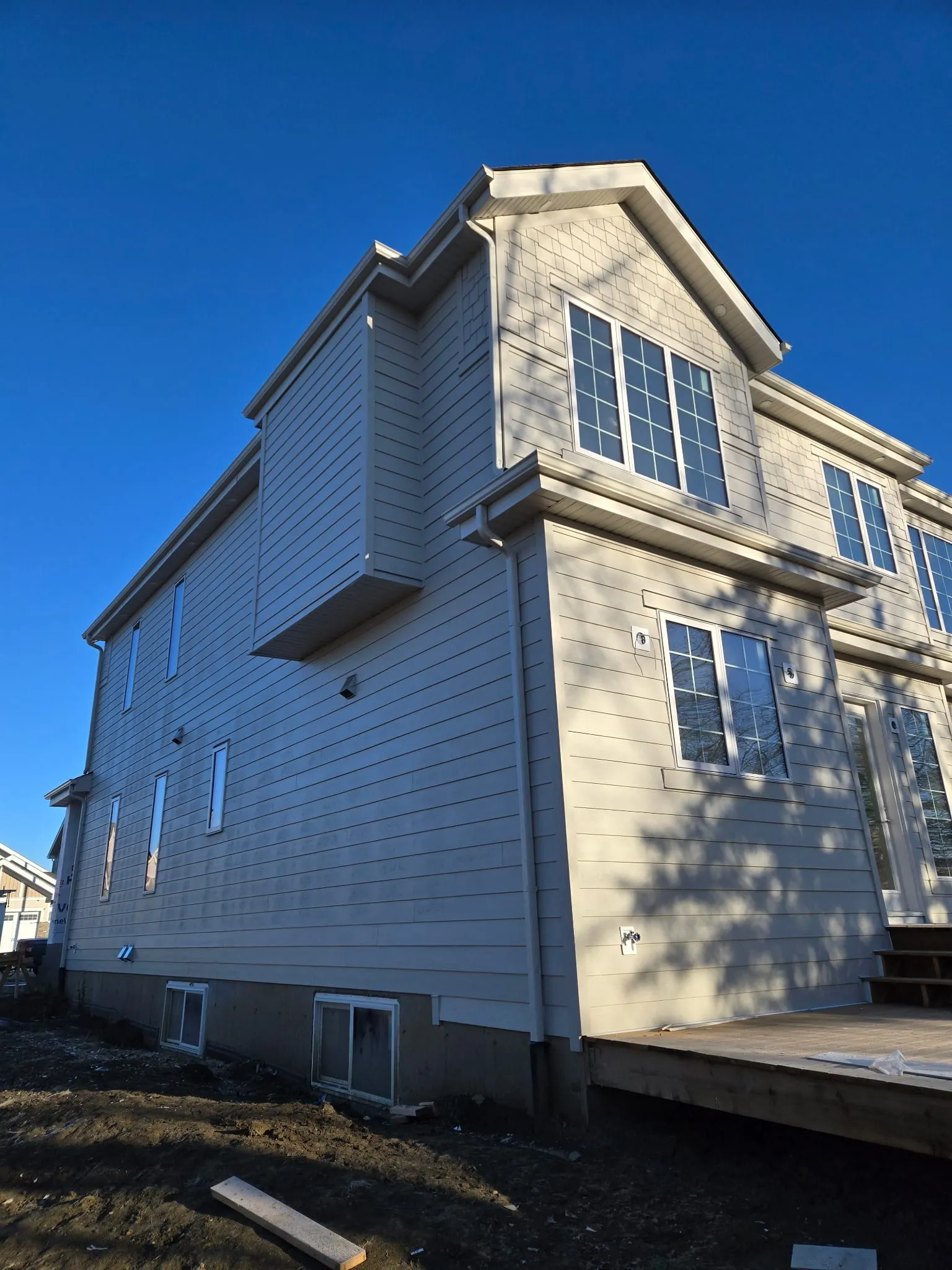 ACR Construction new build light siding two-story home